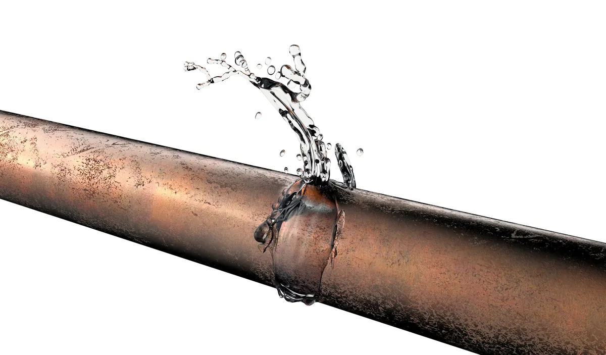 Pinhole leak spraying from a copper pipe, from our Laguna Beach guide: Lead Solder in Older Laguna Beach Copper Pipes